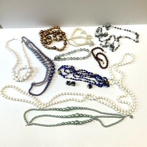 Ten vintage bead necklaces.  Fun, props, theatrical, dress-up.